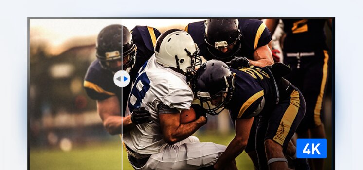 Football game in 4K resolution showing a player tackling another on the field.