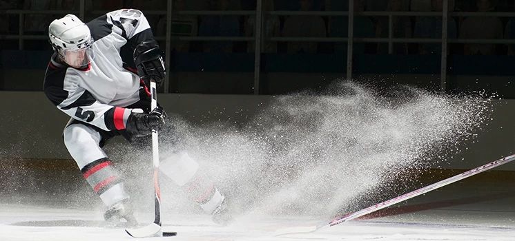 Pro hockey player on ice.