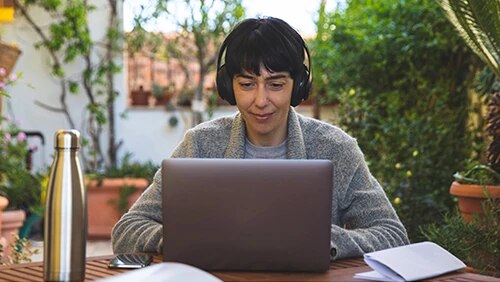 Person typing on PC.